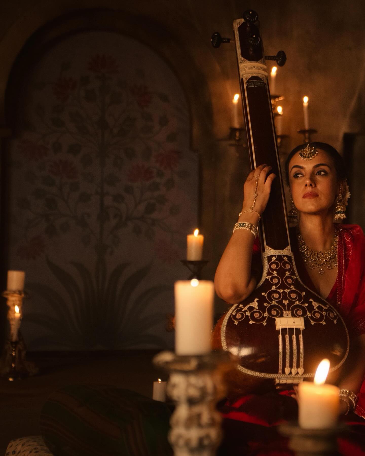 Candle and tambourine still